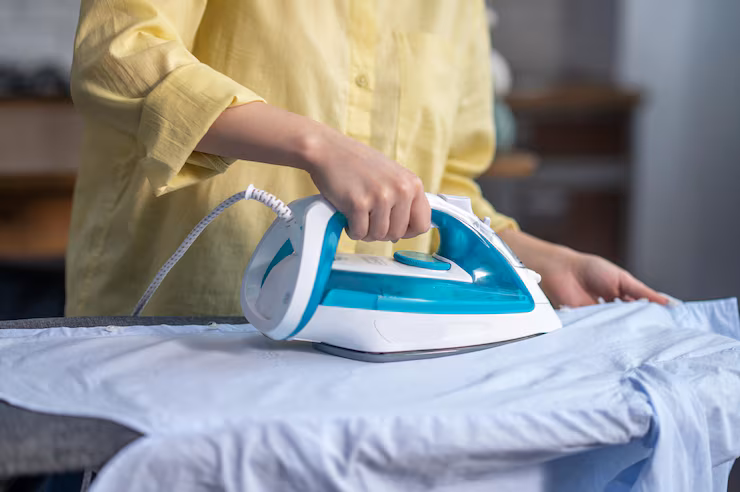 female hands ironing wrinkled clothes ironing board 259150 58449